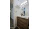 Bathroom featuring a wood vanity with modern hardware and a stylish mirror with decorative accents at 4754 N 14Th St, Phoenix, AZ 85014