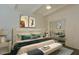 Stylish bedroom with modern art, comfortable bedding, and mirrored closet doors at 4754 N 14Th St, Phoenix, AZ 85014