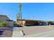 A large, covered parking structure surrounded by mature palm trees offers shaded parking at 4754 N 14Th St, Phoenix, AZ 85014