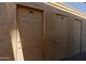 View of a row of locked, outdoor, tan colored storage doors for resident use and convenience at 4754 N 14Th St, Phoenix, AZ 85014