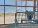 Views through the screened windows of a greenhouse showcasing the desert landscape at 48822 N Roughrider Rd, New River, AZ 85087