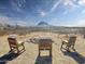 Outdoor seating area with mountain views offering a tranquil escape and relaxation at 48822 N Roughrider Rd, New River, AZ 85087