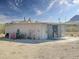 Exterior of a metal storage building or workshop, offering ample storage on the property at 48822 N Roughrider Rd, New River, AZ 85087