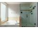 Well-lit bathroom with soaking tub and glass shower, complemented by neutral tile and modern fixtures at 4887 E Armor St, Cave Creek, AZ 85331