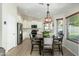 Dining area adjacent to the kitchen, features a modern table with seating for four and stylish overhead lighting at 4887 E Armor St, Cave Creek, AZ 85331