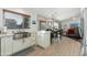 Bright kitchen with white cabinets, stainless steel appliances, farmhouse sink and an adjacent dining area at 4887 E Armor St, Cave Creek, AZ 85331