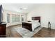 Spacious main bedroom featuring a large bed, neutral walls, and a bay window for natural light at 4887 E Armor St, Cave Creek, AZ 85331