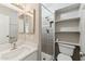 Updated bathroom with a tiled shower, modern vanity, and built-in shelving, offering a spa-like experience at 510 N Alma School Rd # 103, Mesa, AZ 85201