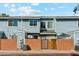 Street view of the property featuring light blue siding and brick privacy wall at 510 N Alma School Rd # 103, Mesa, AZ 85201