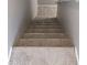 A staircase featuring carpeted steps and neutral walls at 510 N Alma School Rd # 103, Mesa, AZ 85201