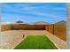 View of backyard featuring low-maintenance landscaping and privacy walls at 5217 E Emery Rd, San Tan Valley, AZ 85143