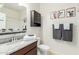 Bathroom featuring granite counters, decorative cabinets, and a walk-in shower at 5217 E Emery Rd, San Tan Valley, AZ 85143