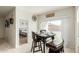 Cozy dining nook featuring a modern table set, and a view of the sliding glass doors and bedroom at 5217 E Emery Rd, San Tan Valley, AZ 85143