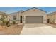 Charming single-story home featuring a neutral color palette, two-car garage and low-maintenance landscaping at 5217 E Emery Rd, San Tan Valley, AZ 85143