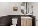 Modern powder room featuring a stylish vanity, updated fixtures and wood-look accent at 5460 S Dillon Cir, Mesa, AZ 85212