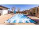 Hot tub with bubbling water surrounded by lounge seating and cabanas at 5460 S Dillon Cir, Mesa, AZ 85212