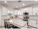 Bright, modern kitchen with an island, stainless steel appliances and a large window at 5460 S Dillon Cir, Mesa, AZ 85212