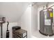 Utility room featuring a water heater and storage with an open layout at 5460 S Dillon Cir, Mesa, AZ 85212