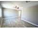 Inviting living room with tile floors, grey walls, a ceiling fan, and a bright window providing natural light at 6029 S 6Th Ave, Phoenix, AZ 85041