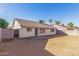 The backyard features a patio, block fence, and desert landscaping at 6132 E Casper St, Mesa, AZ 85205