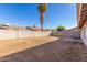 The backyard features a patio, block fence, and desert landscaping at 6132 E Casper St, Mesa, AZ 85205