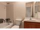 Bathroom showing the bathtub, toilet, sink, and vanity at 6132 E Casper St, Mesa, AZ 85205