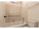 Bathroom area features a bathtub with shower and safety rail at 6132 E Casper St, Mesa, AZ 85205