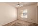 Bedroom with a window, carpeted floor and a ceiling fan at 6132 E Casper St, Mesa, AZ 85205