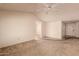 Spacious living room featuring vaulted ceilings, neutral walls, a ceiling fan, and open access to other rooms at 6132 E Casper St, Mesa, AZ 85205