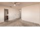 A bright bedroom with a ceiling fan and neutral walls at 6132 E Casper St, Mesa, AZ 85205