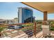 Balcony with grill, offering views of the surrounding cityscape and palm trees at 7147 E Rancho Vista Dr # 6011, Scottsdale, AZ 85251