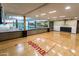 Spacious indoor basketball court next to a pool, featuring hardwood floors and an 'optima' logo at 7147 E Rancho Vista Dr # 6011, Scottsdale, AZ 85251