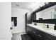 Bathroom featuring a double sink vanity with black cabinets and a modern design at 7147 E Rancho Vista Dr # 6011, Scottsdale, AZ 85251