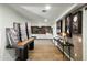 Hallway leading to a living room, features art displays and hardwood floors, showcasing the home's design at 7147 E Rancho Vista Dr # 6011, Scottsdale, AZ 85251