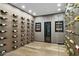 Wine cellar featuring custom wall racks and display cases for storing wine bottles and temperature control units at 7147 E Rancho Vista Dr # 6011, Scottsdale, AZ 85251