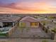 Aerial view of the backyard with desert landscaping, perimeter fence, and covered patio at 7165 S Bruins Rd, Gold Canyon, AZ 85118