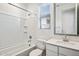 Bathroom featuring tub, shower and single sink with quartz countertops and decorative framed mirror at 7165 S Bruins Rd, Gold Canyon, AZ 85118