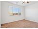 Bedroom featuring carpet, neutral paint, ceiling fan, window with blinds, and white trim at 7165 S Bruins Rd, Gold Canyon, AZ 85118