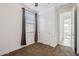 Bedroom with closet, window with dark curtains, and views into the hallway at 7165 S Bruins Rd, Gold Canyon, AZ 85118