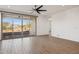 Open concept living area featuring a ceiling fan, tile floors and sliding glass doors at 7165 S Bruins Rd, Gold Canyon, AZ 85118