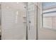 Tiled shower featuring glass door and window to allow in plenty of natural light at 7165 S Bruins Rd, Gold Canyon, AZ 85118