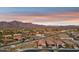 Desert neighborhood street view featuring attractive homes and beautiful views of the nearby mountains at 7165 S Bruins Rd, Gold Canyon, AZ 85118