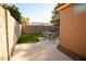 Private backyard featuring artificial turf, patio area, and block wall providing a serene outdoor space at 723 W Canary Way, Chandler, AZ 85286