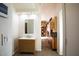 Bright bathroom featuring a modern vanity and mirror, with a view to the rest of the living space at 723 W Canary Way, Chandler, AZ 85286