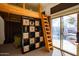 Bedroom with lofted bed, storage shelves, and sliding glass doors leading to an outdoor space at 723 W Canary Way, Chandler, AZ 85286