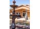 This backyard features an ornate fountain with water cascading into a sparkling pool, complemented by an umbrella for shade at 723 W Canary Way, Chandler, AZ 85286