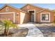 Inviting home with a walkway leading to the front entrance, complemented by desert landscaping and neutral tones at 723 W Canary Way, Chandler, AZ 85286