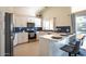 Stylish kitchen featuring updated appliances, a breakfast bar, and modern cabinetry at 723 W Canary Way, Chandler, AZ 85286