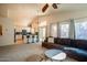 Open-concept living area with a seamless transition to the kitchen, overlooking a sparkling pool at 723 W Canary Way, Chandler, AZ 85286