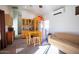 Living room with kitchenette, table, and chairs, providing a functional and inviting space for everyday living at 723 W Canary Way, Chandler, AZ 85286